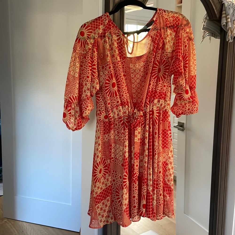 Mini dress with spaghetti strap orange lining sewn in with adjustable belt/cinch